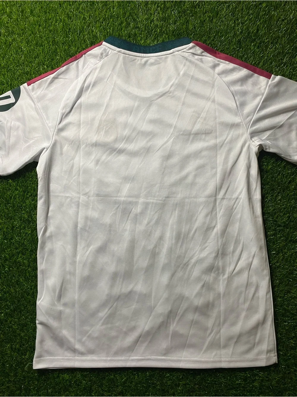 Real Madrid Home Jersey - White with Burgundy and Dark Green Accents